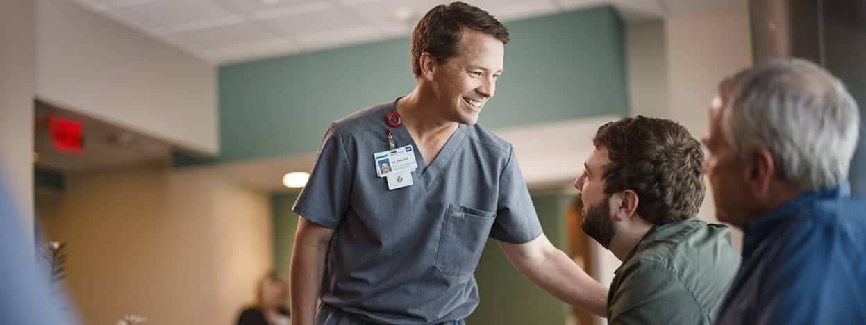 Doctor speaking with patients