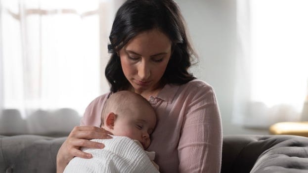 Woman holding a baby