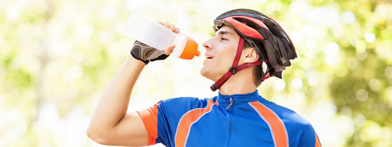 Cyclist drinks water