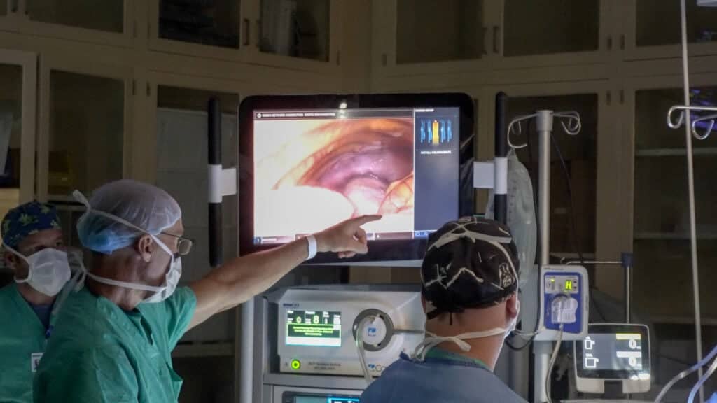 Nurse tech pointing at monitor