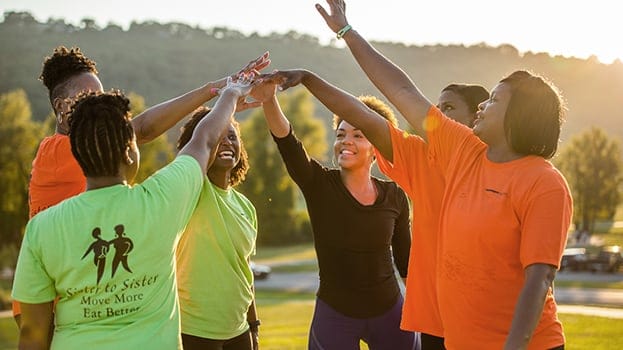 A group of workers cheering