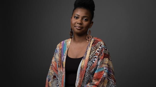 Woman with musical note earrings